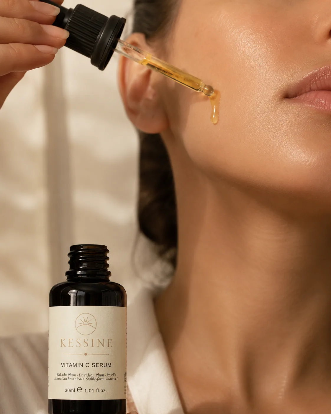 A few drops of Kessine serum applied to clean skin in soft morning light